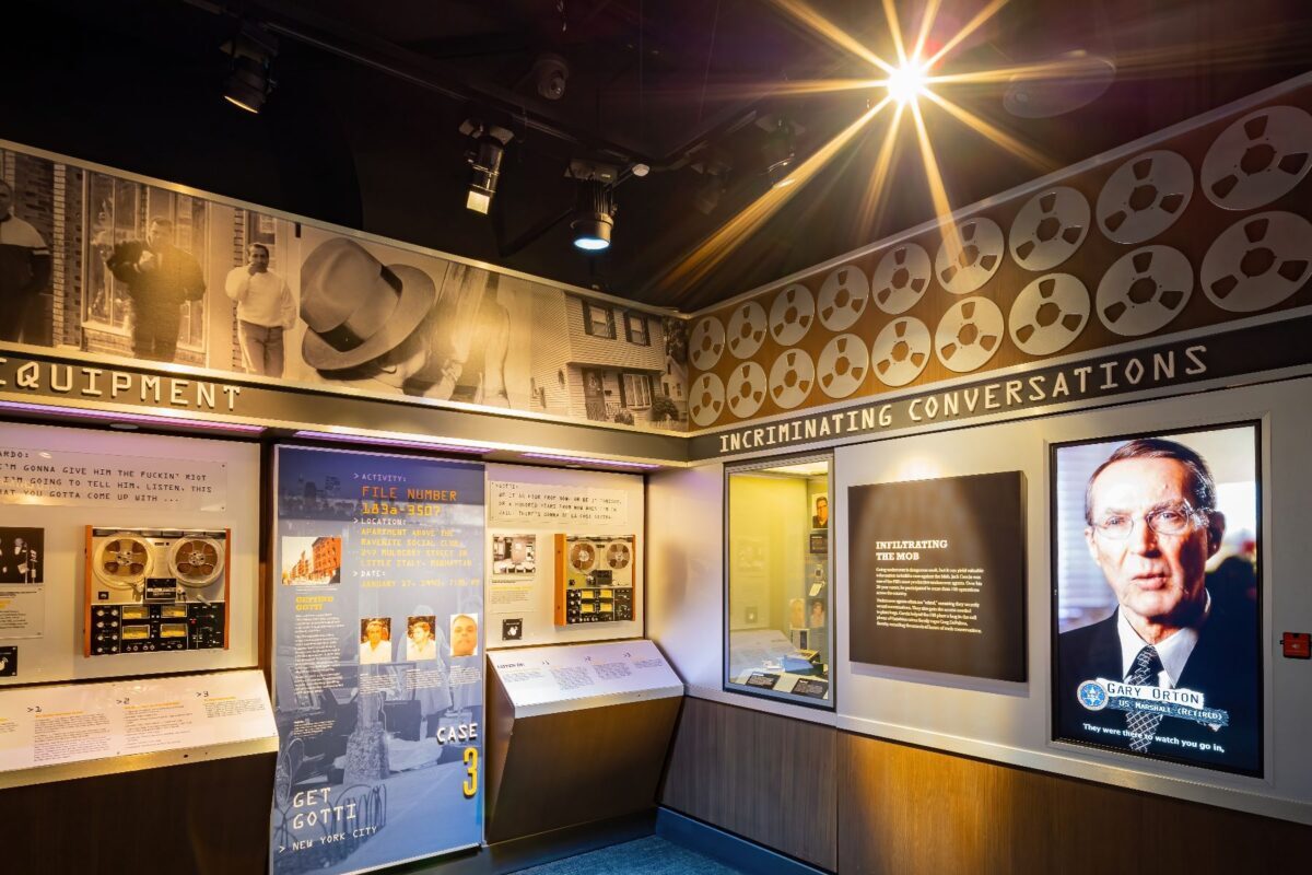 Exhibit at The Mob Museum in Las Vegas showing surveillance equipment and historic FBI case files - one of the best museums in Las Vegas